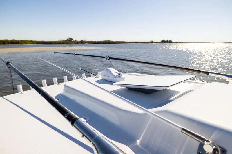  Yacht Photos Pics 2024 Yellowfin 39 Offshore boat with fishing rods on deck, scenic water view.