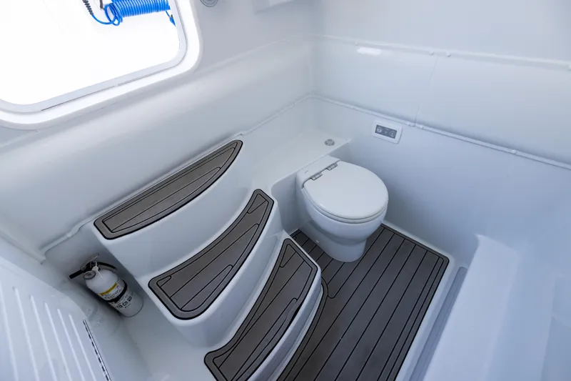  Yacht Photos Pics 2024 Yellowfin 39 Offshore boat bathroom with toilet and non-slip flooring.