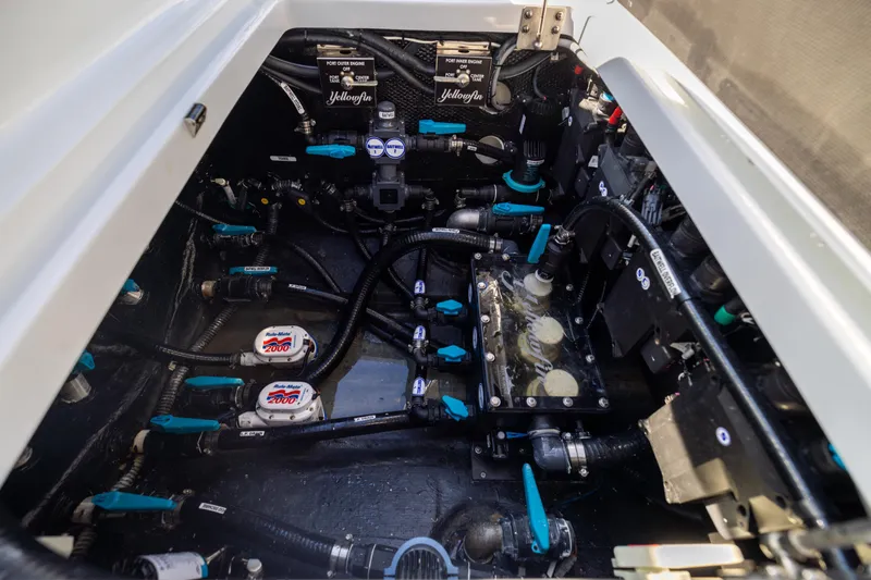  Yacht Photos Pics Engine compartment of 2024 Yellowfin 39 Offshore boat, showcasing intricate wiring and components.