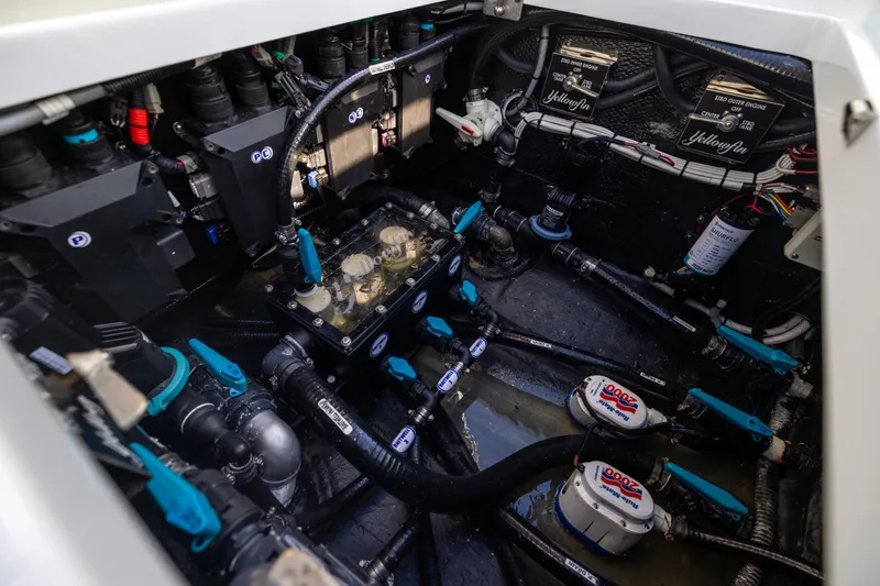  Yacht Photos Pics Engine compartment of 2024 Yellowfin 39 Offshore boat, showcasing intricate wiring and components.