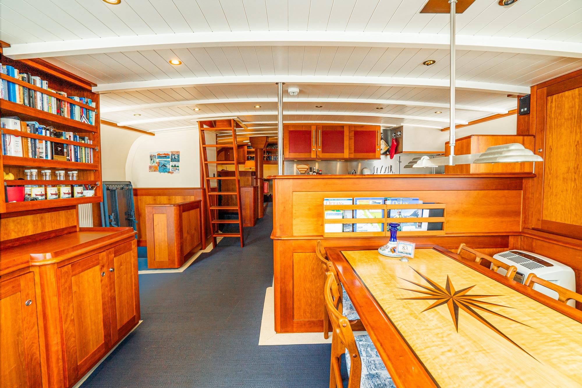 Luxurious 1965 Van der Molen Custom yacht interior with elegant wood finishes and modern amenities.
