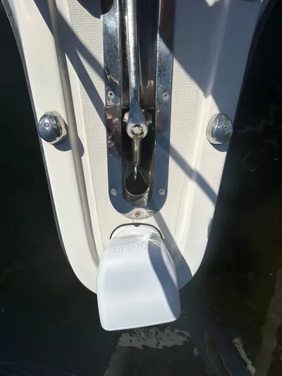 Reel Estate Yacht Photos Pics 1998 Tiara Yachts 3500 Express anchor mechanism detail with white cover.