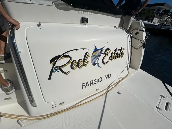 Reel Estate Yacht Photos Pics 1998 Tiara Yachts 3500 Express with "Reel Estate" name, docked in Fargo, ND.