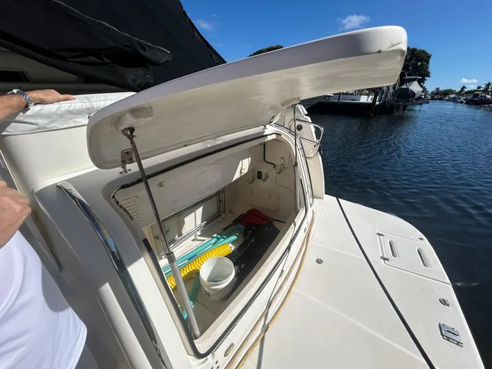 Reel Estate Yacht Photos Pics Open storage compartment on a 1998 Tiara Yachts 3500 Express by the water.