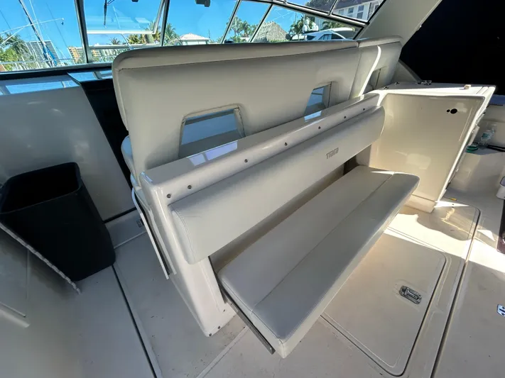 Reel Estate Yacht Photos Pics 1998 Tiara Yachts 3500 Express interior with white seating and modern design.