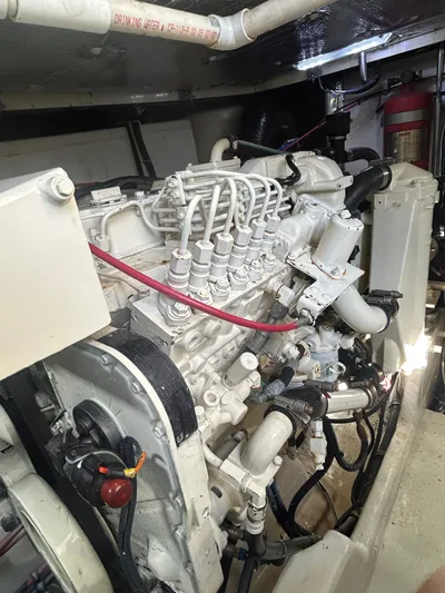 Reel Estate Yacht Photos Pics Engine compartment of a 1998 Tiara Yachts 3500 Express, showcasing detailed mechanical components.