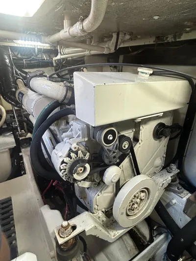 Reel Estate Yacht Photos Pics Engine compartment of a 1998 Tiara Yachts 3500 Express, showcasing mechanical components.