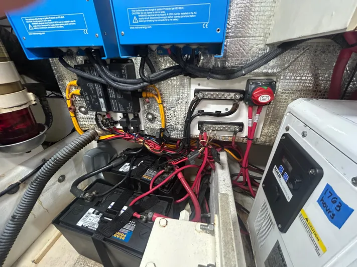 Reel Estate Yacht Photos Pics Electrical system of a 1998 Tiara Yachts 3500 Express, featuring batteries and wiring components.