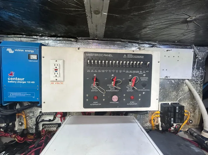 Reel Estate Yacht Photos Pics Electrical control panel on a 1998 Tiara Yachts 3500 Express, featuring a Victron Energy charger.