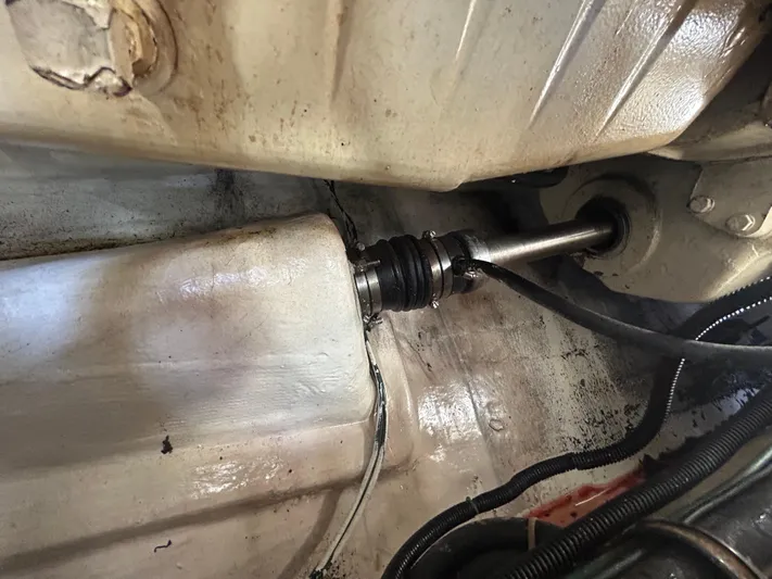 Reel Estate Yacht Photos Pics Engine compartment of a 1998 Tiara Yachts 3500 Express, showing mechanical components and wiring.