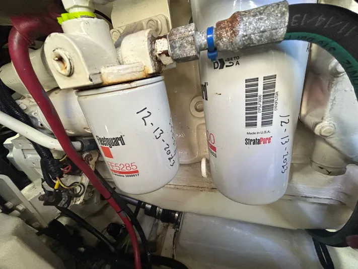 Reel Estate Yacht Photos Pics Engine components of a 1998 Tiara Yachts 3500 Express, featuring fuel filters with maintenance dates.