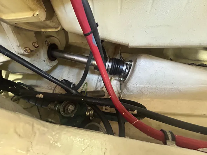 Reel Estate Yacht Photos Pics Engine compartment of a 1998 Tiara Yachts 3500 Express, showing cables and mechanical components.