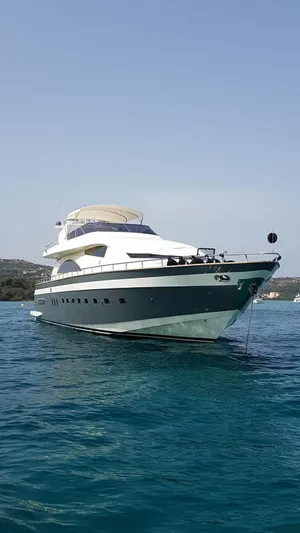  Yacht Photos Pics Luxury yacht PerMare Amer 86, 2007 model, anchored in clear blue waters.