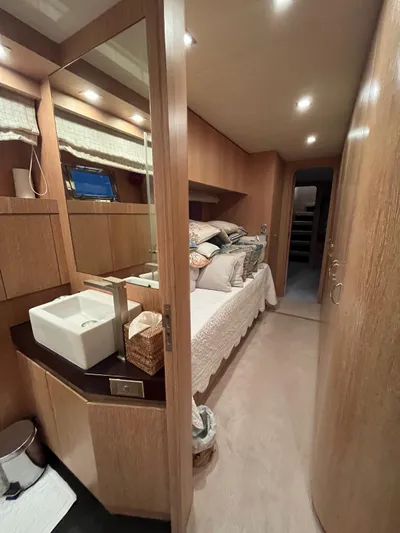  Yacht Photos Pics Luxurious cabin interior of 2007 PerMare Amer 86 yacht with modern wood finishes.