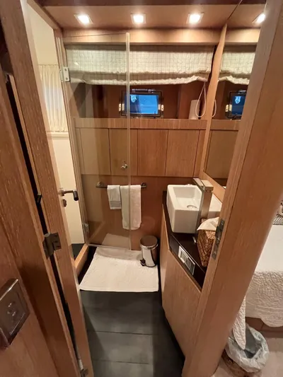  Yacht Photos Pics Luxurious bathroom interior of 2007 PerMare Amer 86 yacht with modern fixtures and wooden accents.