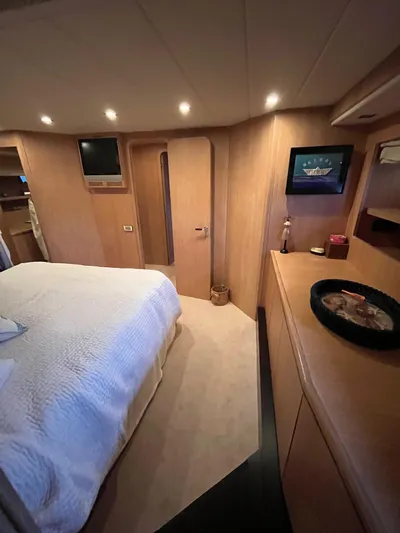  Yacht Photos Pics Luxurious bedroom interior of 2007 PerMare Amer 86 yacht with modern decor.