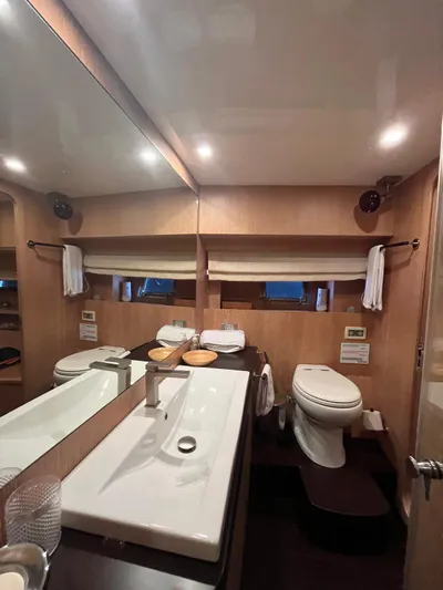  Yacht Photos Pics Luxurious bathroom interior of 2007 PerMare Amer 86 yacht with modern fixtures.