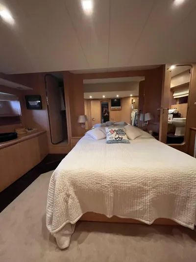  Yacht Photos Pics Luxurious bedroom interior of 2007 PerMare Amer 86 yacht with elegant decor.