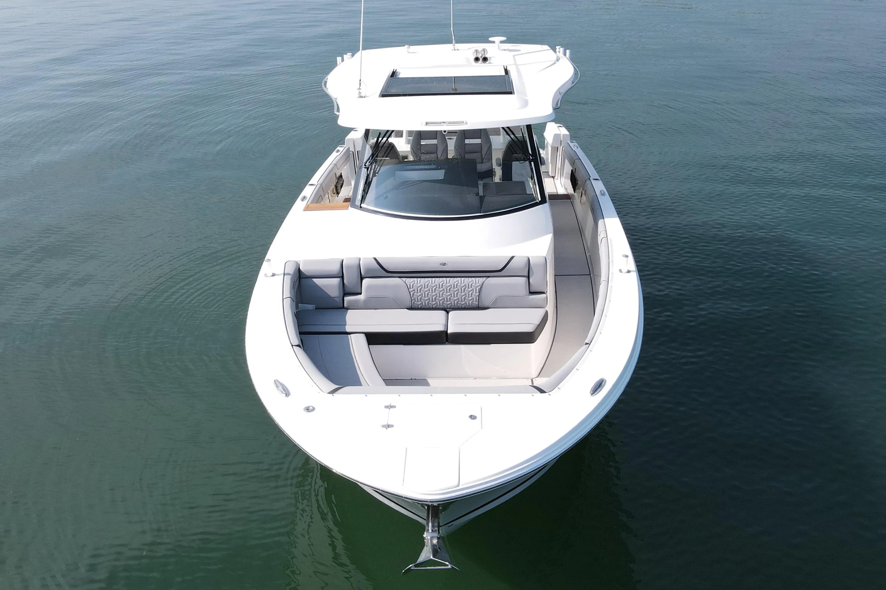 2024 Regal 38 Surf boat on calm water, aerial view.