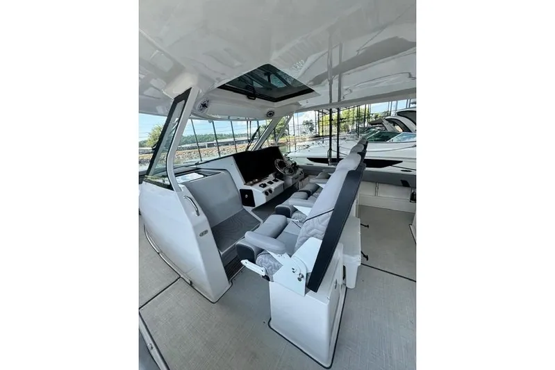 It's Good Yacht Photos Pics 2024 Regal 38 Surf boat interior with modern helm and seating.