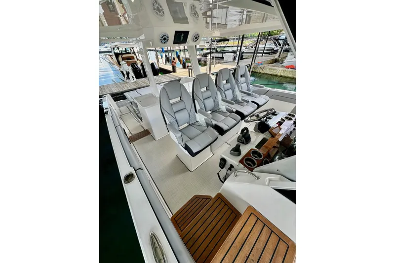 It's Good Yacht Photos Pics 2024 Regal 38 Surf boat interior with luxurious seating and modern controls at the dock.