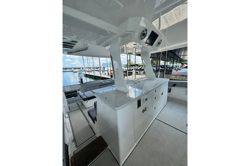 It's Good Yacht Photos Pics 2024 Regal 38 Surf boat interior with sleek design and modern amenities at a marina.