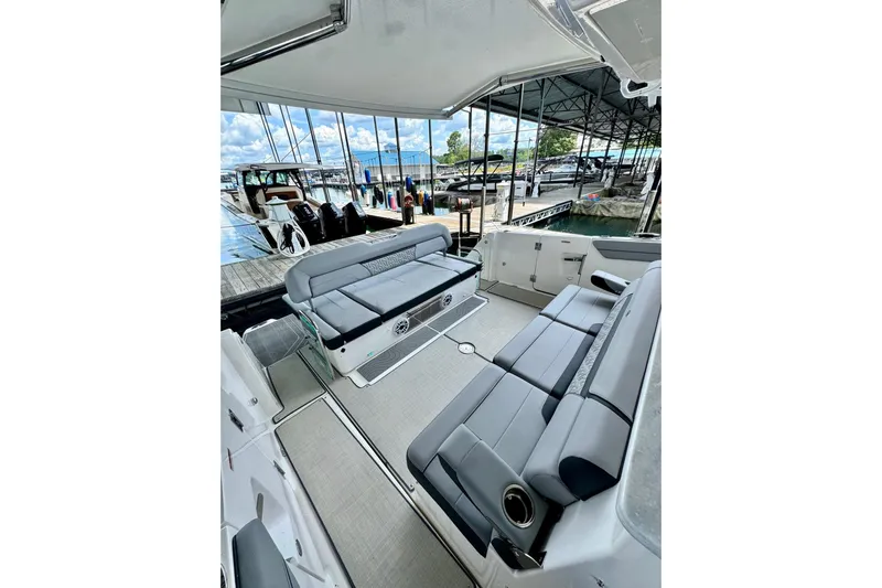 It's Good Yacht Photos Pics 2024 Regal 38 Surf boat interior with gray seating at marina.