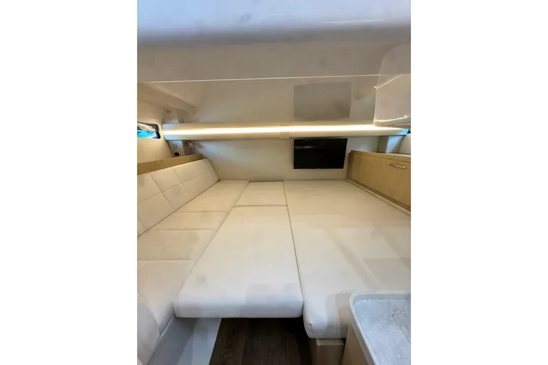 It's Good Yacht Photos Pics 2024 Regal 38 Surf interior cabin with modern seating and ambient lighting.