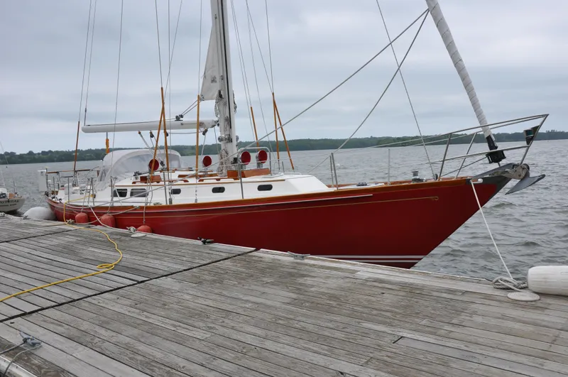 Helianthus Yacht Photos Pics 1985 Hinckley SW 42 sailboat docked at a marina.