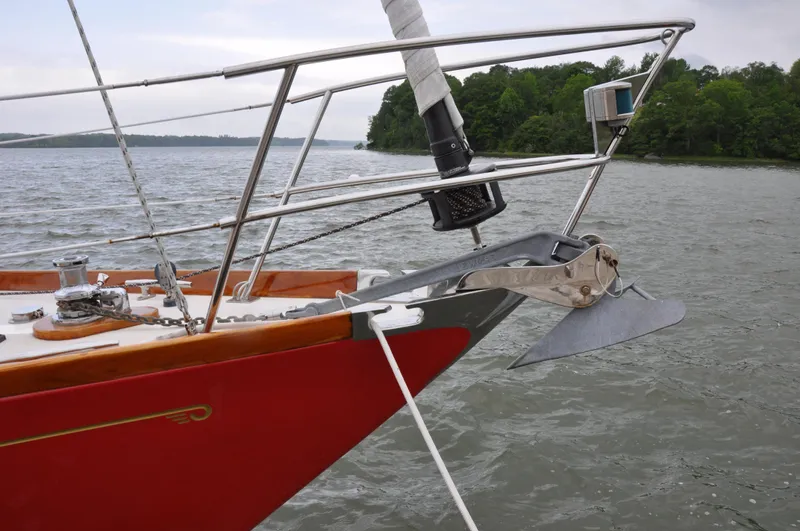 Helianthus Yacht Photos Pics Hinckley SW 42 sailboat bow with anchor, 1985 model, on a calm lake.