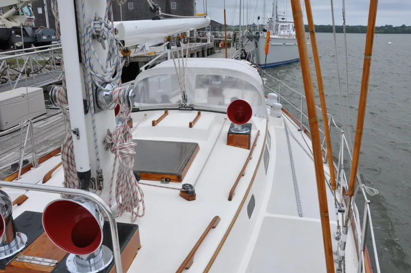 Helianthus Yacht Photos Pics 1985 Hinckley SW 42 sailboat docked at a marina.
