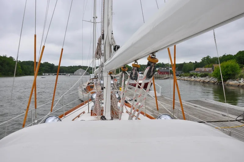 Helianthus Yacht Photos Pics Hinckley SW 42 sailboat docked in a serene marina, 1985 model.