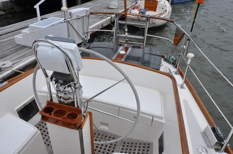 Helianthus Yacht Photos Pics Cockpit of 1985 Hinckley SW 42 sailboat docked at marina.