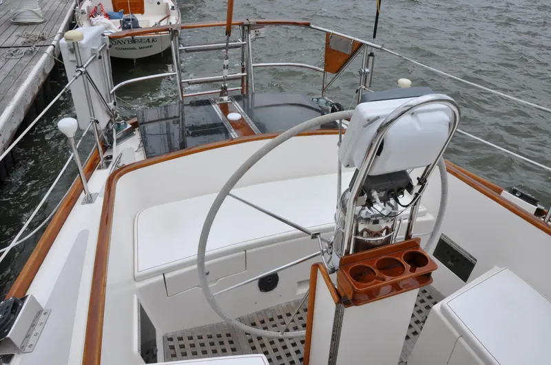 Helianthus Yacht Photos Pics Cockpit of 1985 Hinckley SW 42 sailboat with steering wheel and seating.