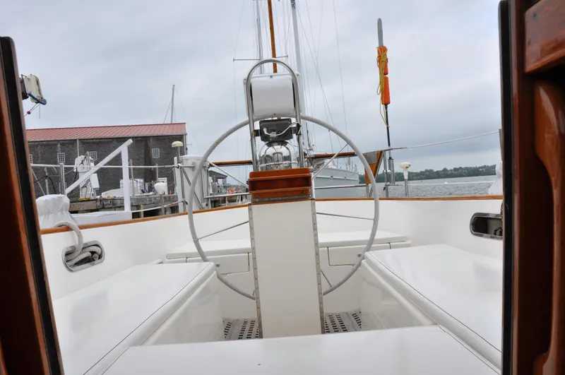 Helianthus Yacht Photos Pics Cockpit view of 1985 Hinckley SW 42 sailboat docked at marina.