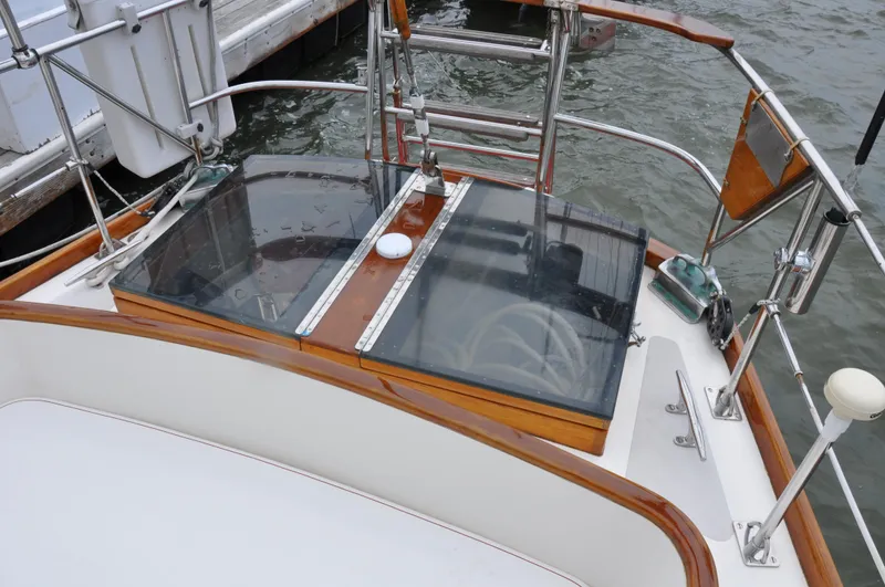Helianthus Yacht Photos Pics 1985 Hinckley SW 42 sailboat cockpit with wooden trim and glass hatch.