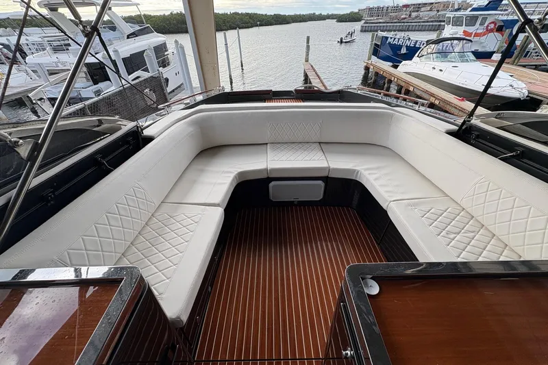 La Ruta Yacht Photos Pics Luxurious seating area on a 2017 Riva 38' Rivamare yacht at a marina.