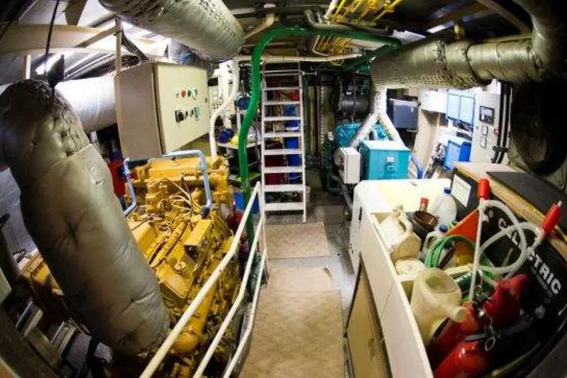 Zeewoelf Yacht Photos Pics Engine room of 1963 Custom mr. de Boot, featuring machinery and control panels.