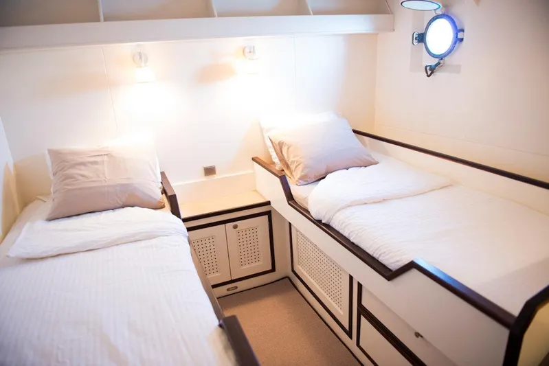 Zeewoelf Yacht Photos Pics Twin beds in a cozy cabin aboard the 1963 Custom mr. de Boot yacht.