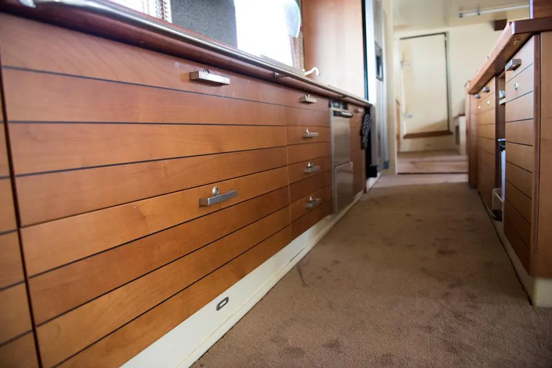 Zeewoelf Yacht Photos Pics Wooden cabinetry in a narrow hallway of a 1963 Custom Mr. de Boot model.