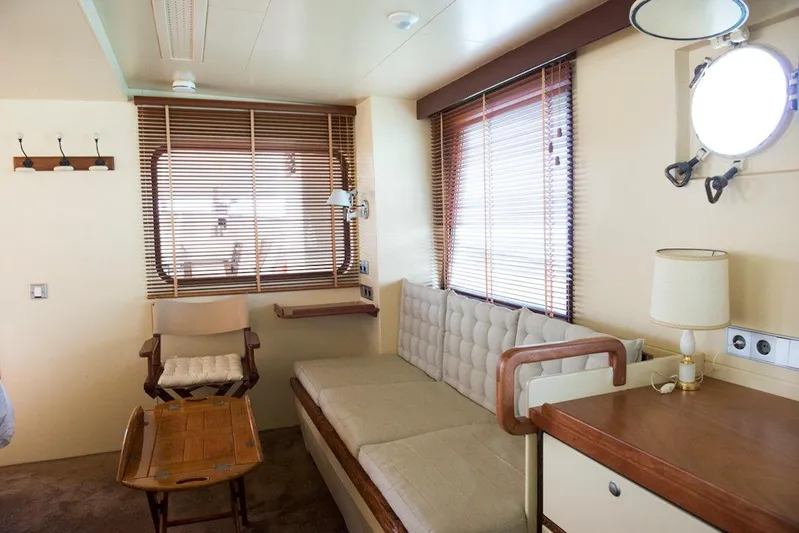 Zeewoelf Yacht Photos Pics Cozy 1963 custom boat interior with seating, wooden blinds, and nautical decor.