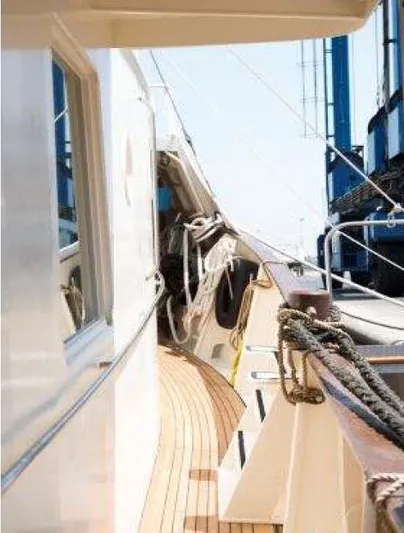 Zeewoelf Yacht Photos Pics Side view of 1963 Custom mr. de Boot yacht with wooden deck and ropes.