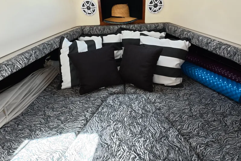 Island Girl Yacht Photos Pics Cozy cabin interior of 1992 Luhrs 300 Tournament with striped and solid cushions.