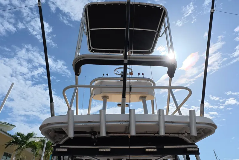 Island Girl Yacht Photos Pics 1992 Luhrs 300 Tournament boat with tower against a sunny sky.