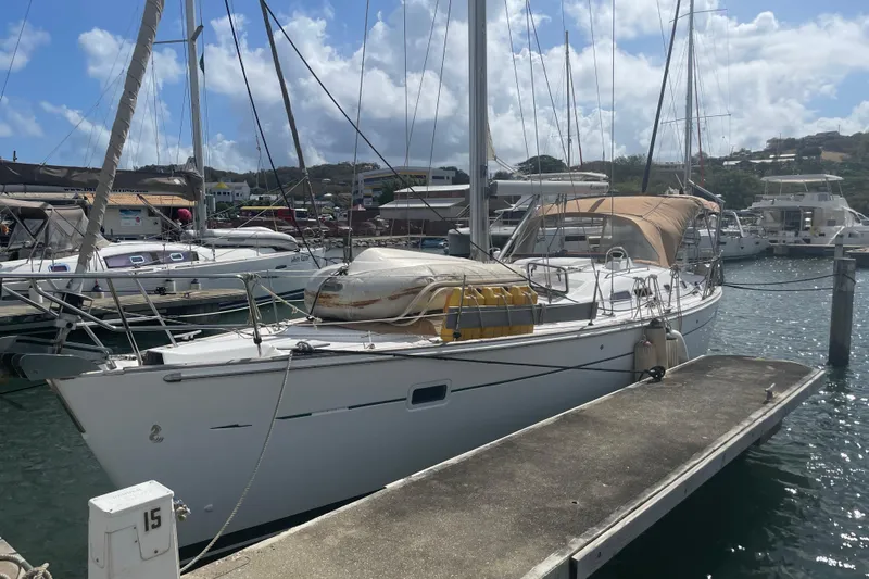 Kasoumai Yacht Photos Pics 2007 Beneteau 423 sailboat docked at marina under a partly cloudy sky.