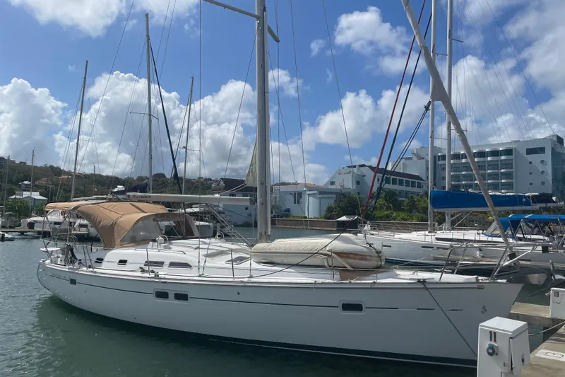 Kasoumai Yacht Photos Pics 2007 Beneteau 423 sailboat docked at marina under blue sky.