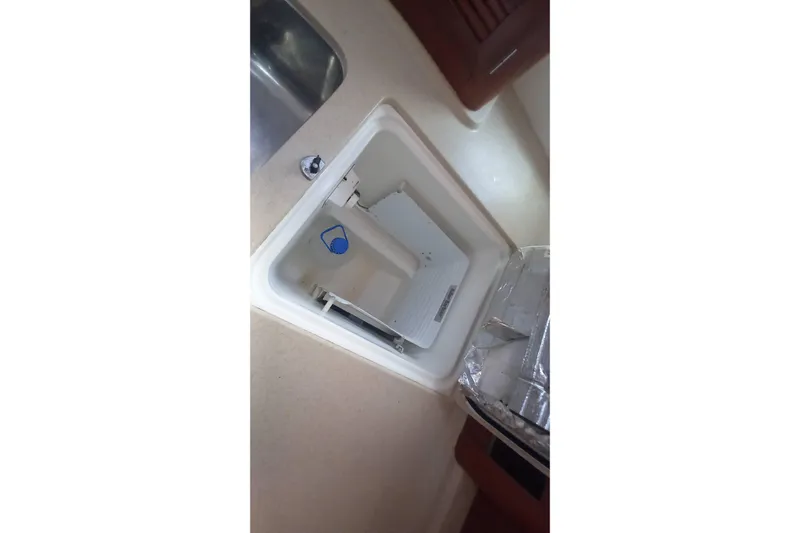 Kasoumai Yacht Photos Pics Beneteau 423 (2007) yacht interior showing a built-in storage compartment.