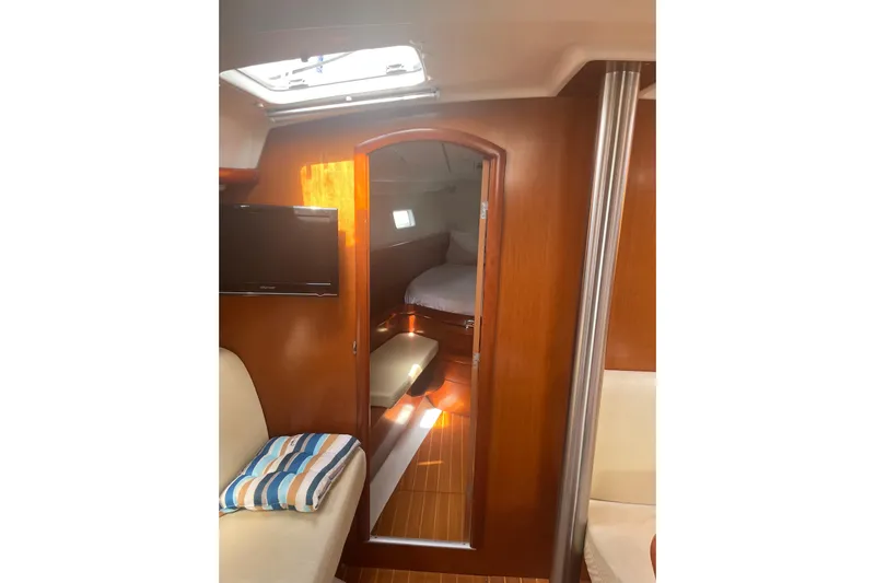Kasoumai Yacht Photos Pics Interior of 2007 Beneteau 423 yacht, featuring cozy cabin with wooden finish and seating.