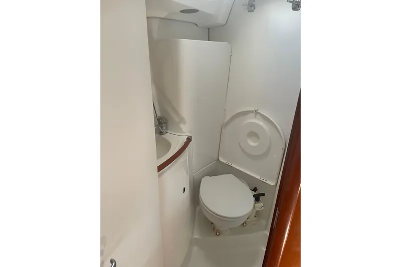 Kasoumai Yacht Photos Pics Compact bathroom in 2007 Beneteau 423 yacht with toilet and sink.