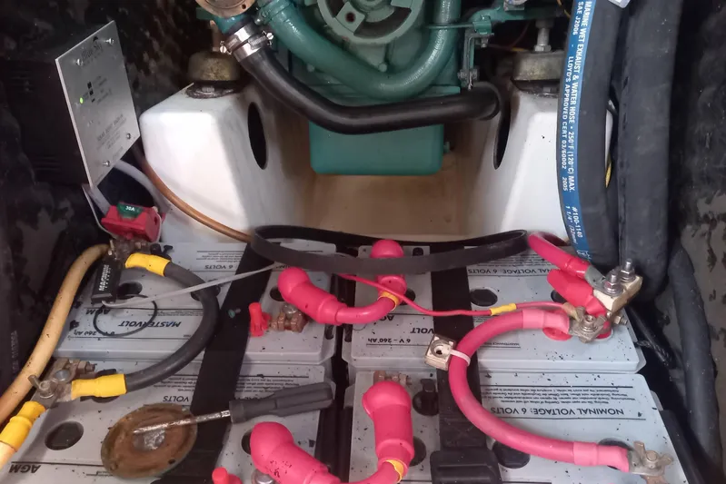 Kasoumai Yacht Photos Pics Engine compartment of a 2007 Beneteau 423 sailboat, featuring batteries and wiring.